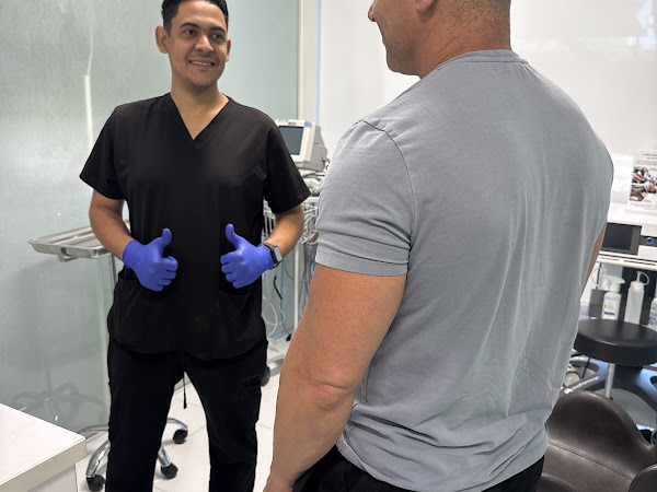 MedSmart staff member with patient David Lax in treatment room